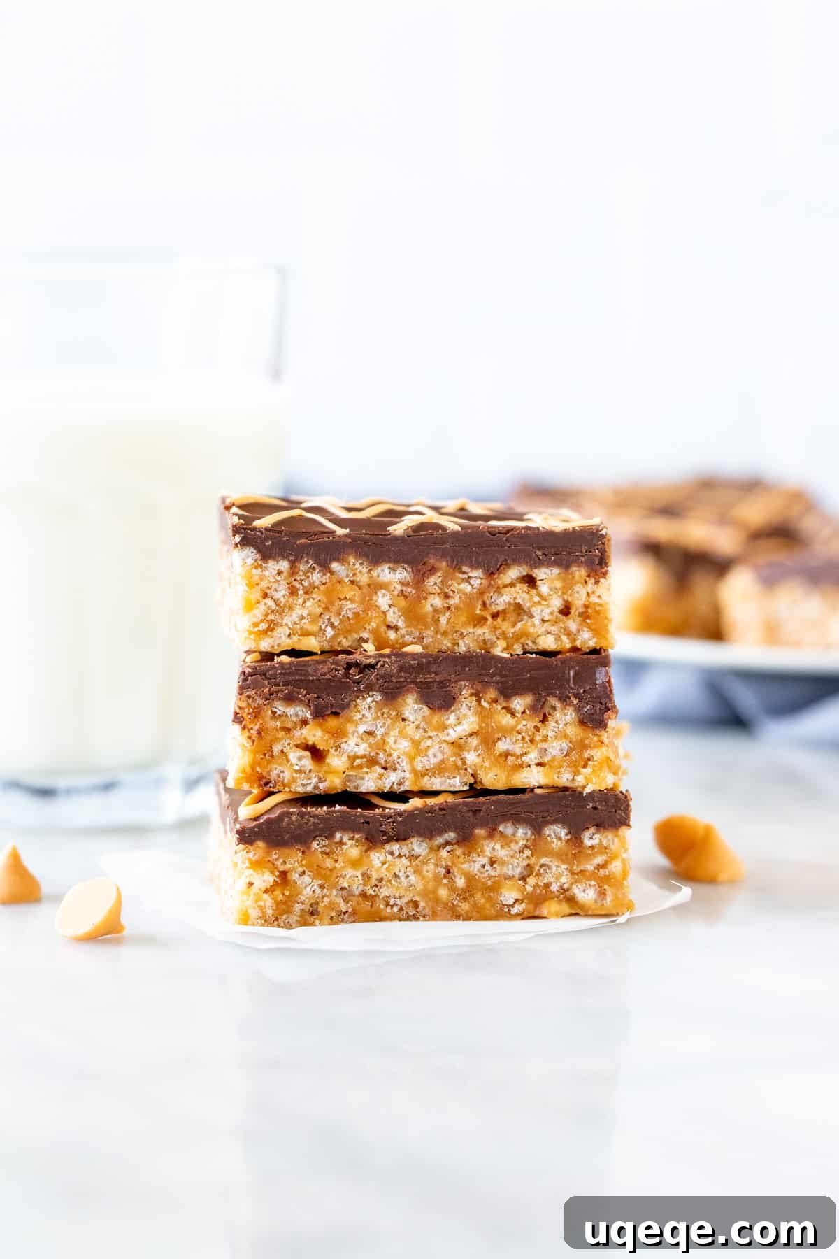 Tiger Bar Golden Butterscotch Crunch 5 Three tiger bars with a clear chocolate and butterscotch topping, stacked enticingly.