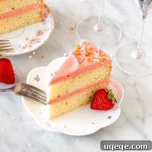 Two slices of Strawberry Champagne Cake on a plate, ready to be served