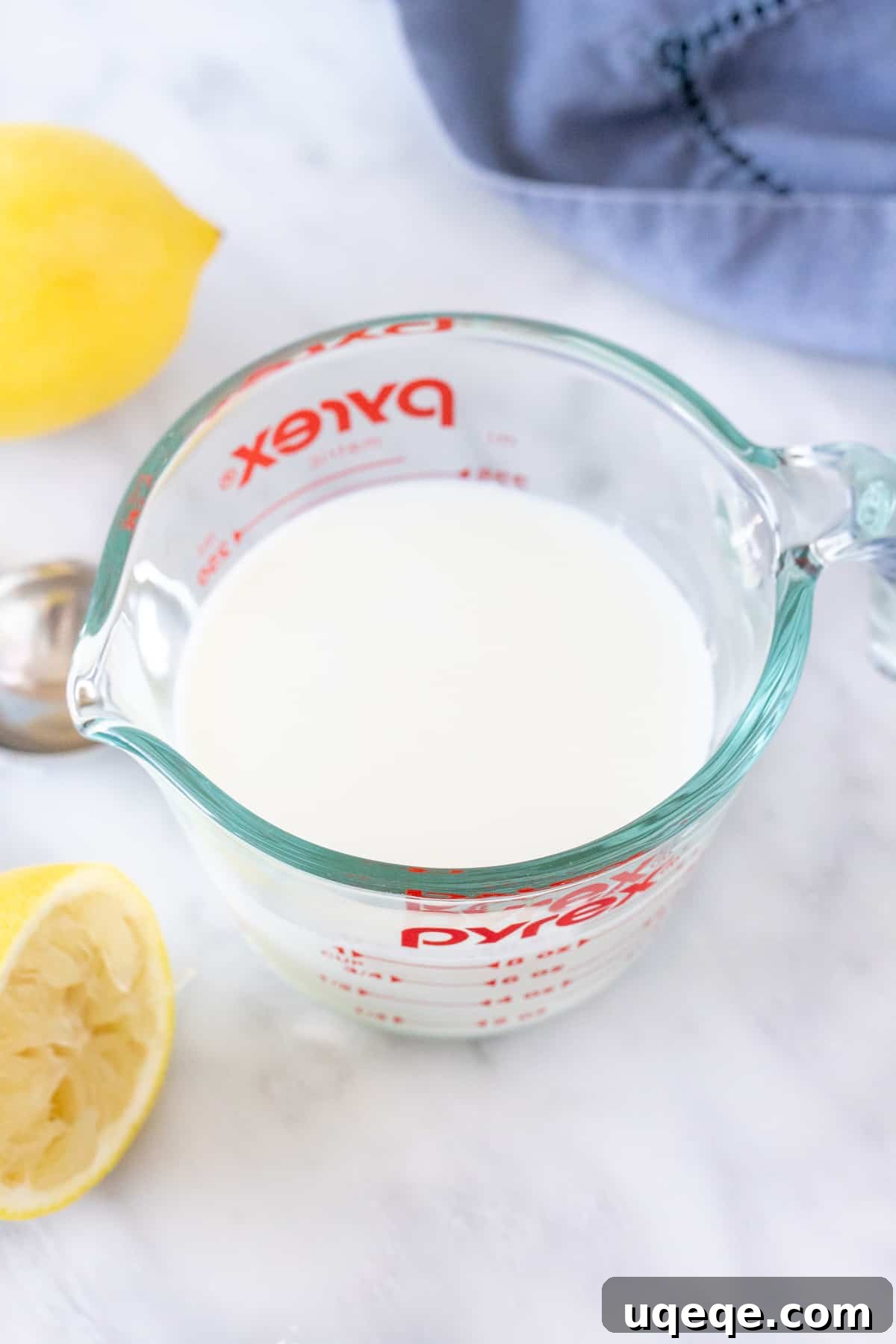 Beyond the Bottle: Crafting Buttermilk, Its Purpose, and Clever Substitutes 3 A second image of homemade buttermilk, showing the curdled texture, made with lemon juice and milk.