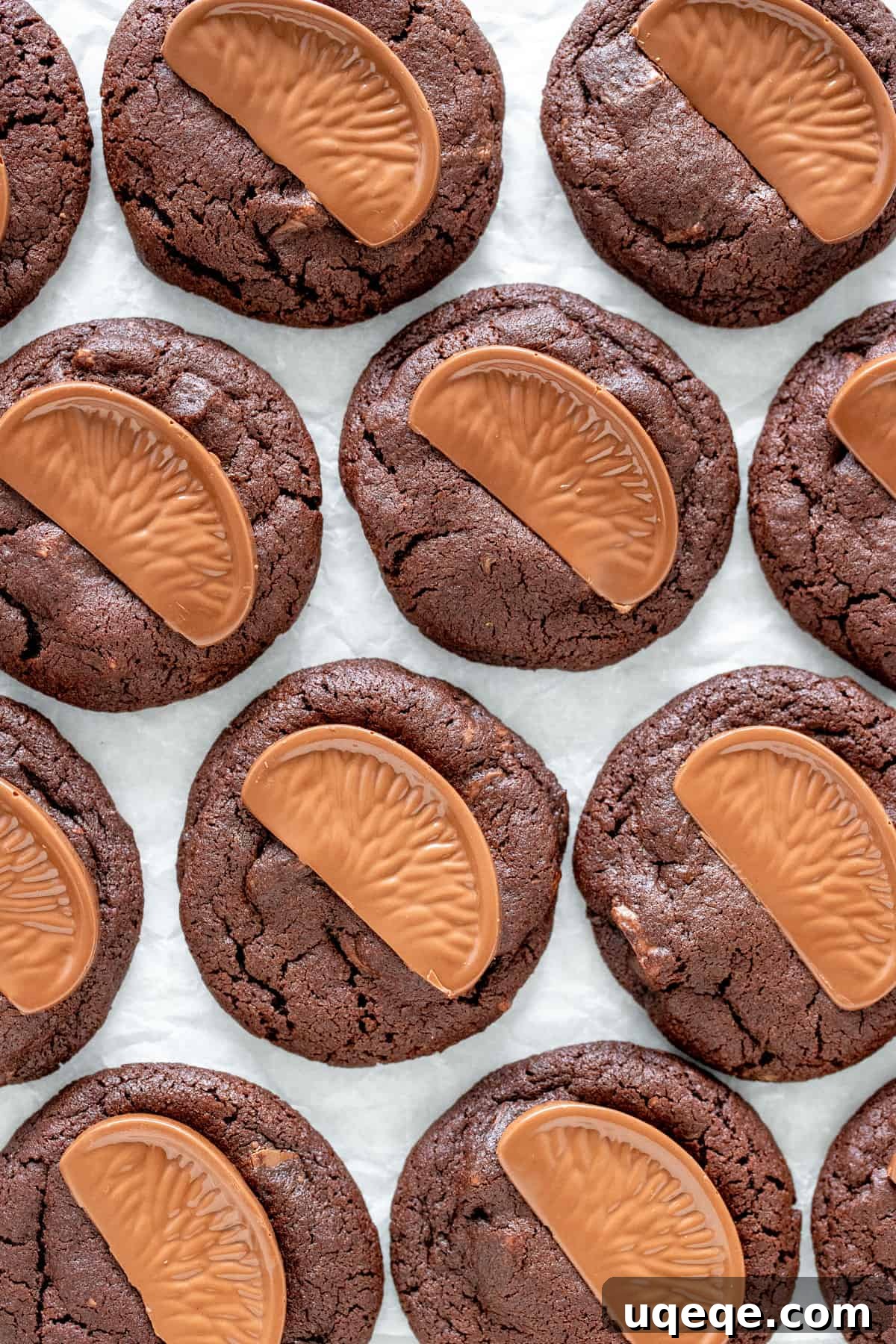 Zesty Chocolate Orange Delights 3 Gourmet chocolate orange cookies with a chocolate orange segment on top, ready to be served.
