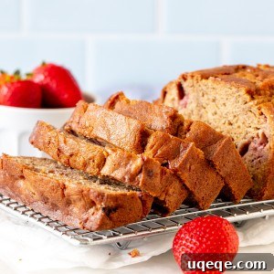 Strawberry banana bread with half the loaf sliced