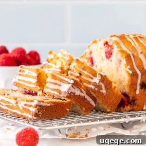 Raspberry bread with 3 slices cut on a cooling rack