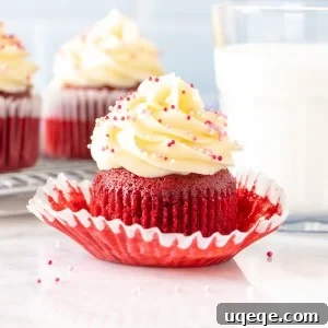 Red velvet cupcake with glass of milk