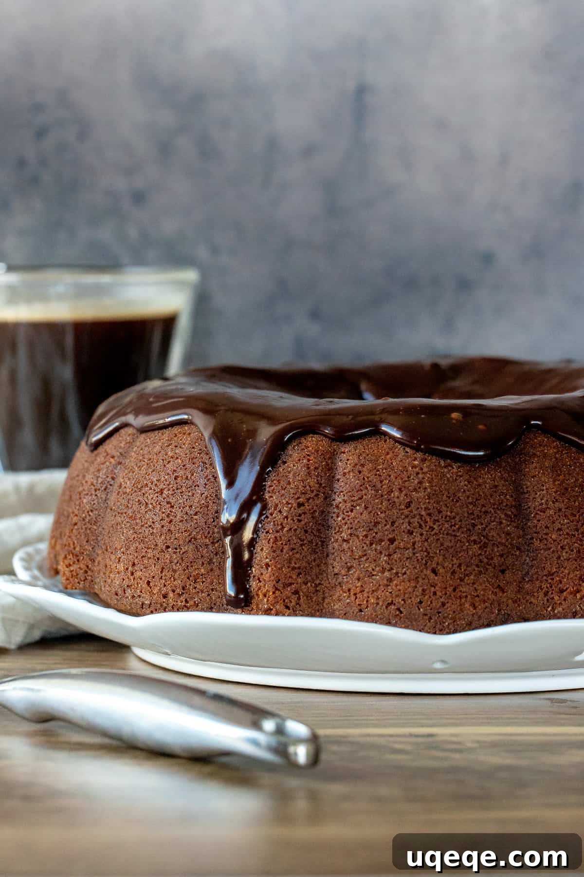 Velvet Coffee Bundt 3 A stunning coffee flavored bundt cake, generously topped with a glistening chocolate ganache, ready to be served
