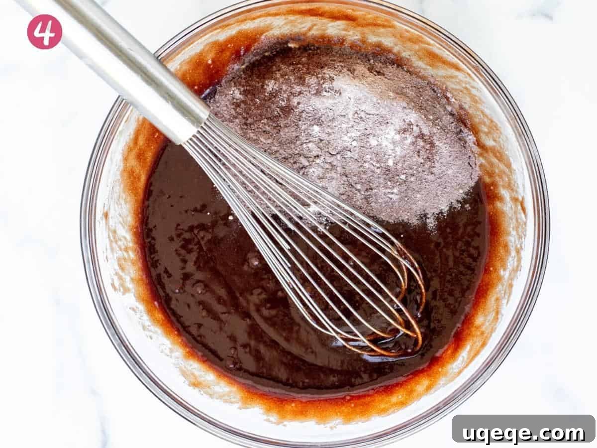 Ultimate Kit Kat Brownie Bars 4 A bowl of rich brownie batter, showing its consistency before the final dry ingredients are fully incorporated.