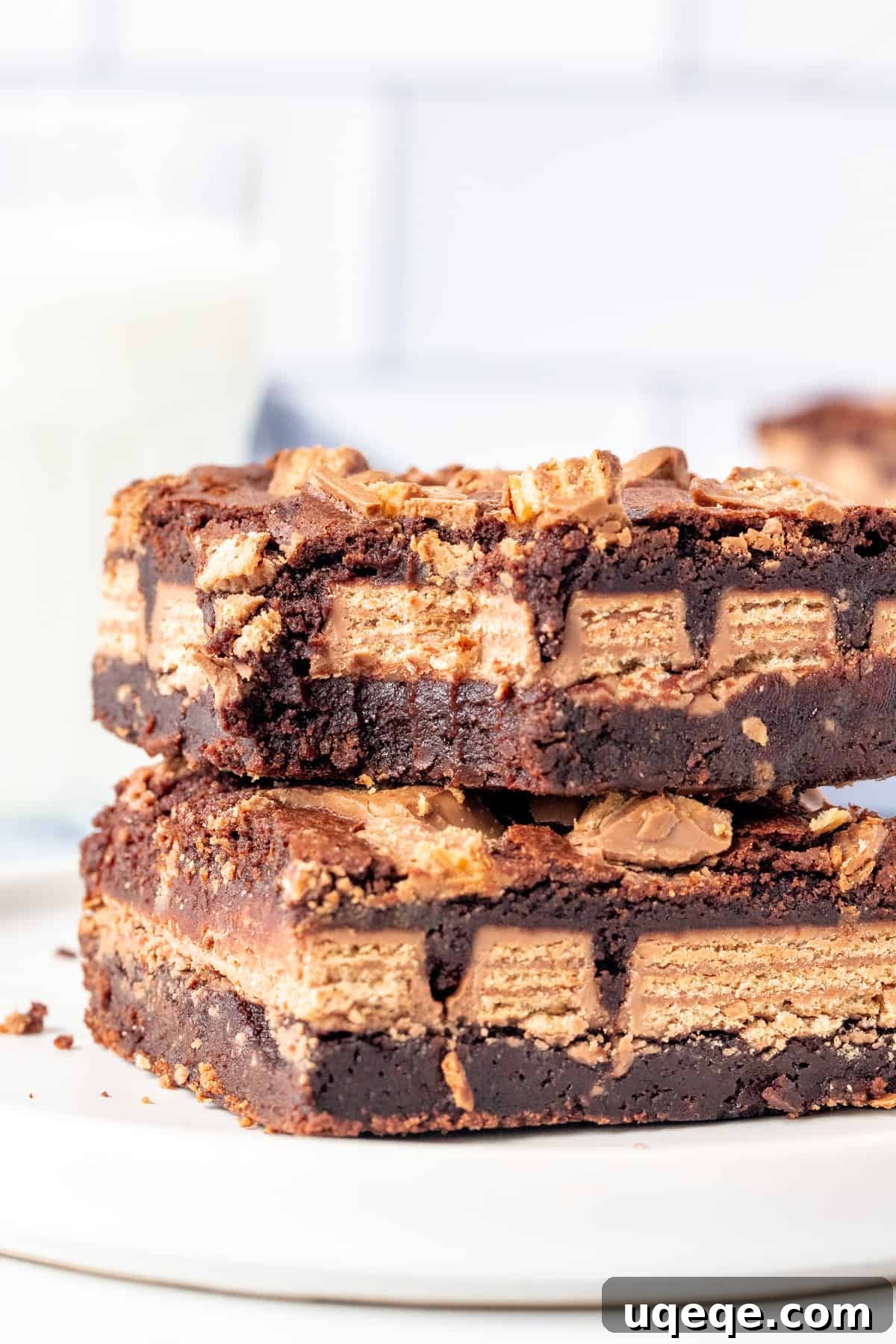 Ultimate Kit Kat Brownie Bars 7 Two perfectly sliced, fudgy Kit Kat stuffed brownies, stacked enticingly.