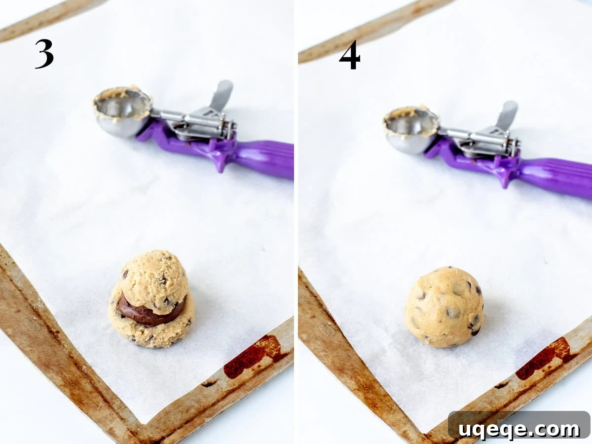 Nutella Lava Cookies 5 Demonstration of stuffing a cookie dough ball with a spoonful of Nutella, showing the sealing process.