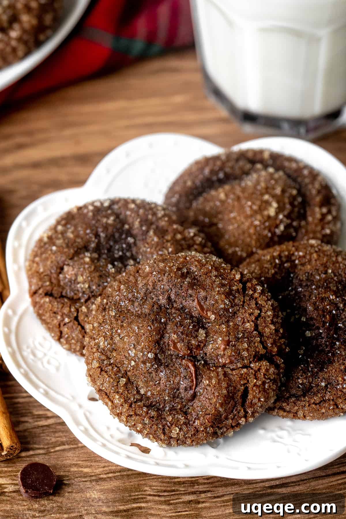 Spiced Chocolate Gingerbread Delights 5 Plate of freshly baked chocolate gingerbread cookies next to a tall glass of milk, inviting a cozy moment.