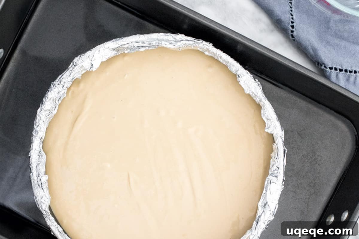 Oreo Crusted Kahlua Cheesecake 3 Cheesecake in a waterbath, demonstrating proper setup for baking