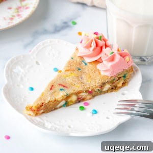 Celebration Sprinkle Cookie Cake 5 A beautiful slice of funfetti sugar cookie cake, ready to be enjoyed.