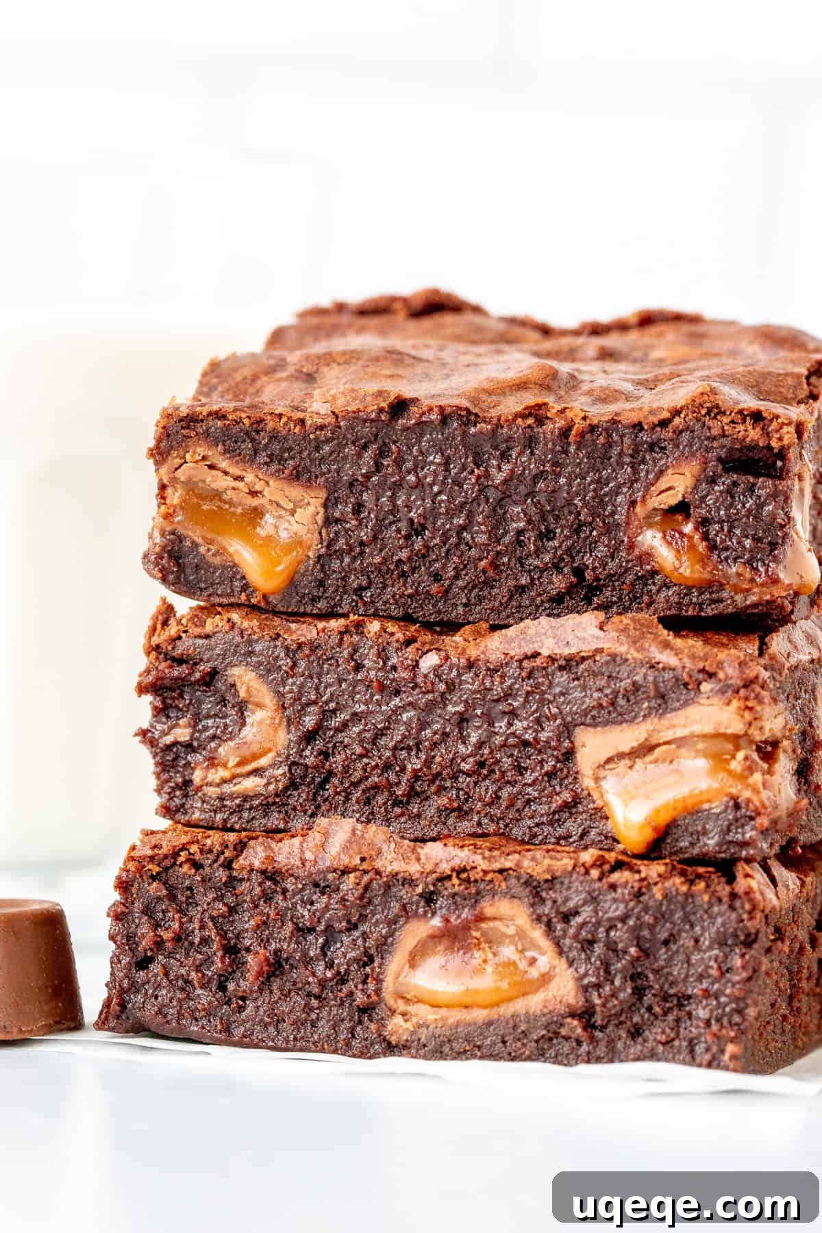 Gooey Rolo Stuffed Brownies 2 Stack of three incredibly fudgy Rolo brownies with visible caramel pools