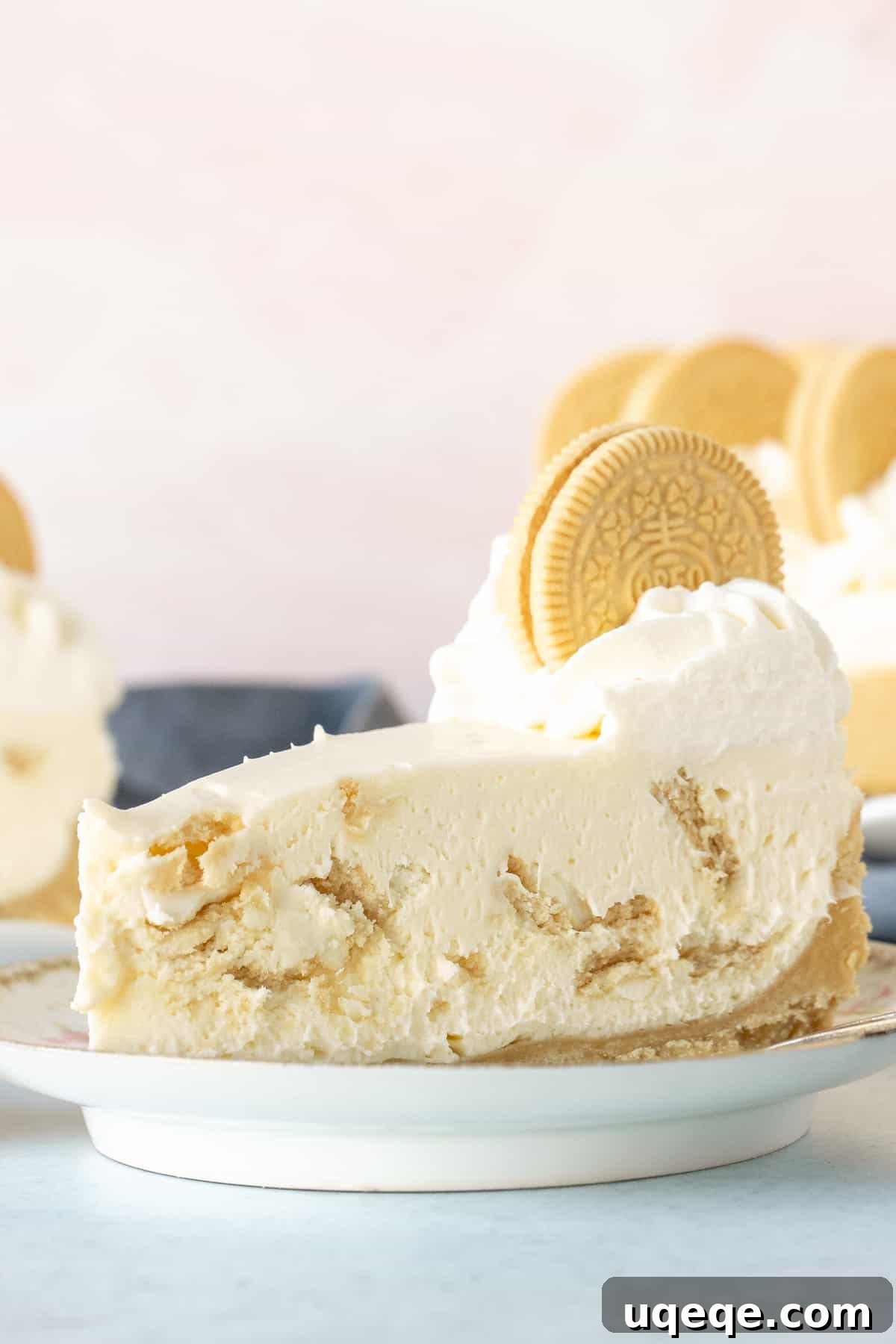 Ultimate Golden Oreo Cheesecake 2 A beautifully sliced Golden Oreo cheesecake showcasing its creamy filling, crunchy crust, and decorative cookie pieces.