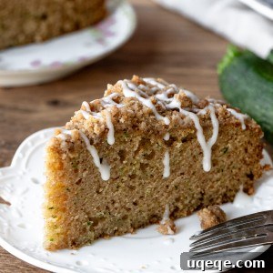 Slice of zucchini coffee cake on a plate