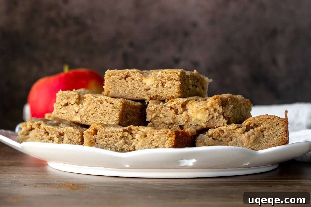 Large plate of cinnamon apple blondies, piled on top of each other