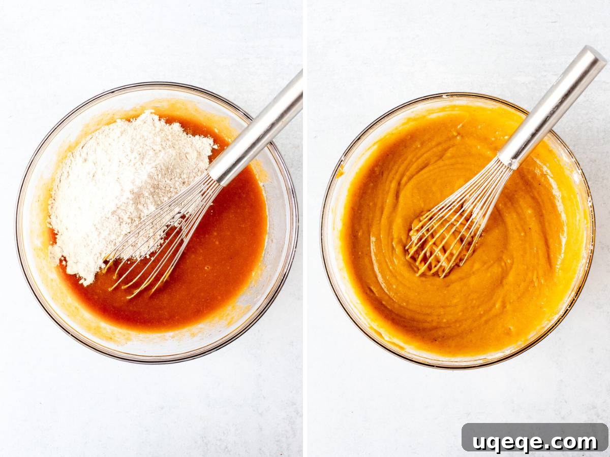 Combining dry and wet ingredients into a smooth pumpkin rum cake batter.