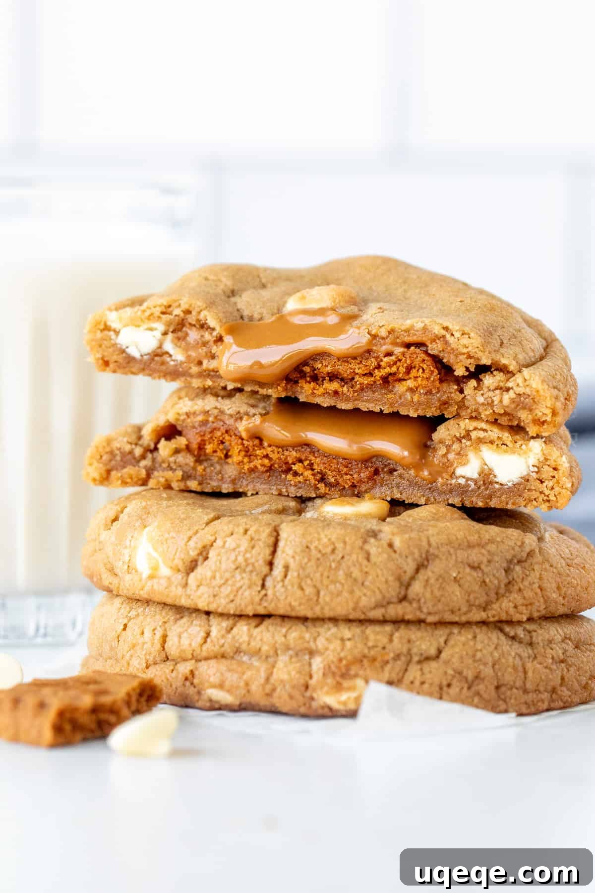 Biscoff Cookies Bursting with Cookie Butter 2 Stack of Biscoff cookies, with top cookie broken in half, revealing gooey center.