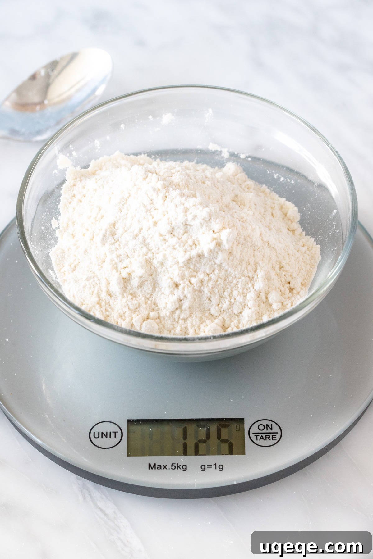 Mastering Flour Measurement With or Without a Kitchen Scale 3 Bowl of flour on kitchen scale with 125 grams