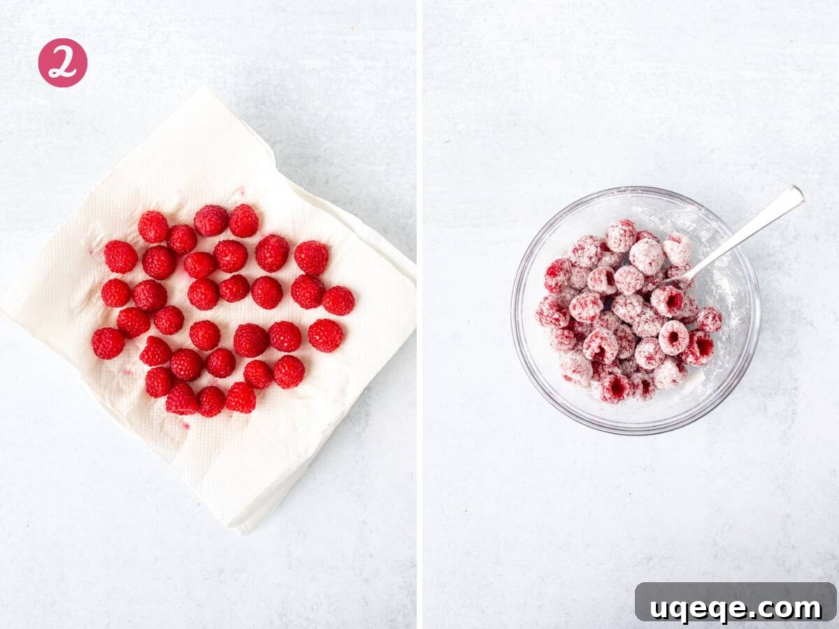 Freshly washed raspberries drying on paper towel, next to a small bowl of raspberries lightly tossed in flour.