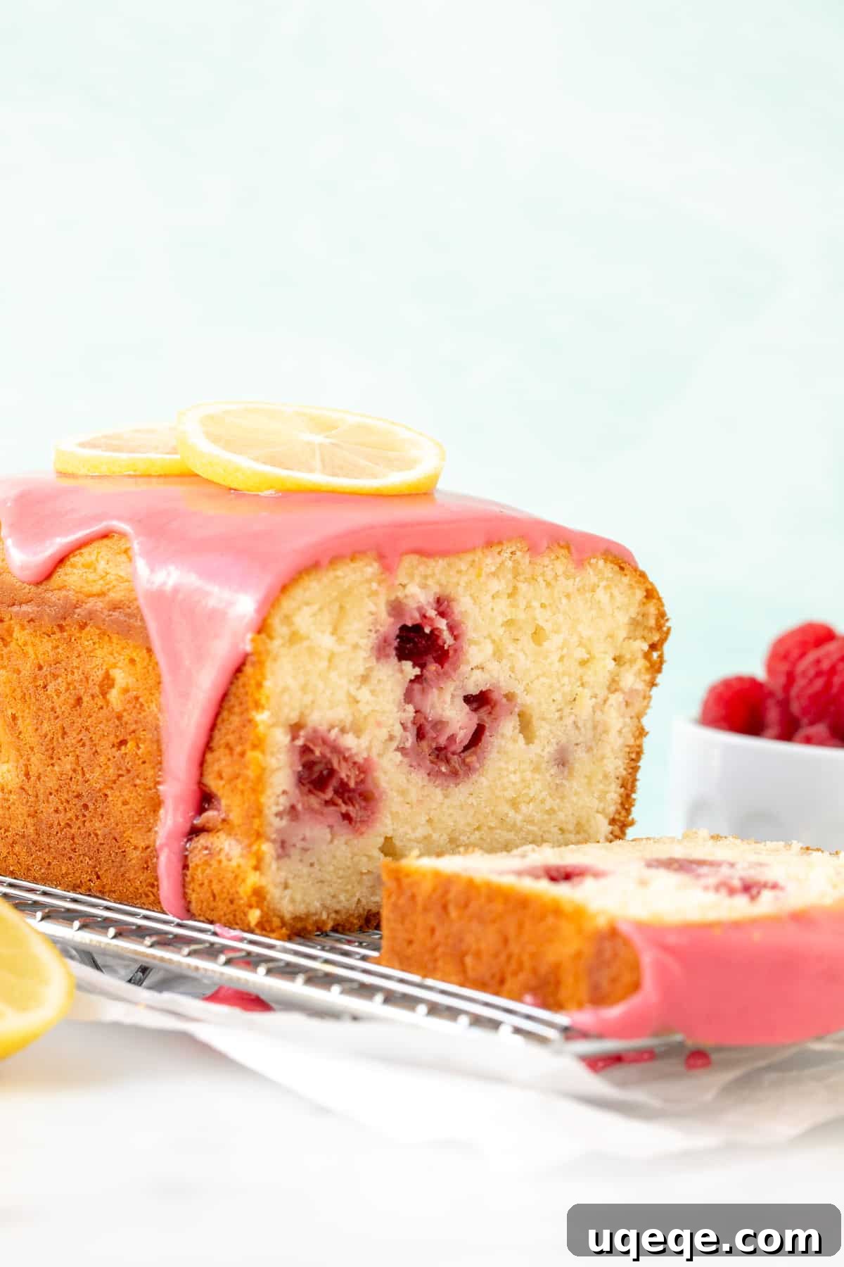 Lemon Berry Bliss Loaf 8 Fully cooled lemon raspberry bread on a wire rack, beautifully coated with a vibrant pink raspberry glaze.