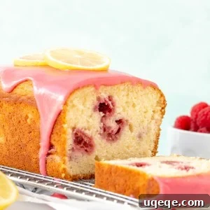 Lemon raspberry bread with raspberry glaze on a cooling rack