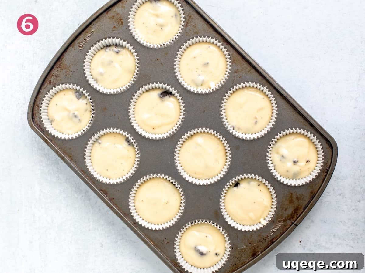 Muffin tin of unbaked Oreo cupcakes