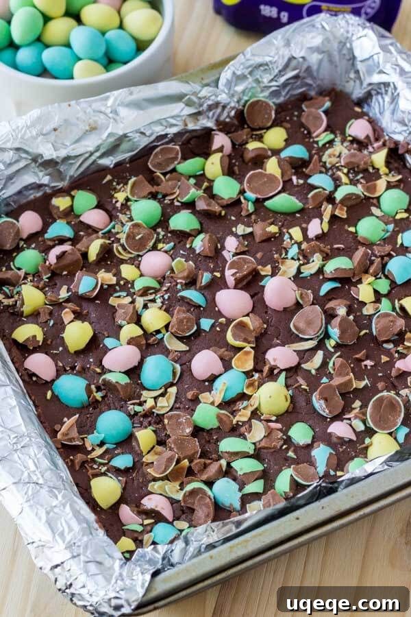 Close-up of smooth, creamy Easter Chocolate Fudge, beautifully topped with colorful mini eggs.