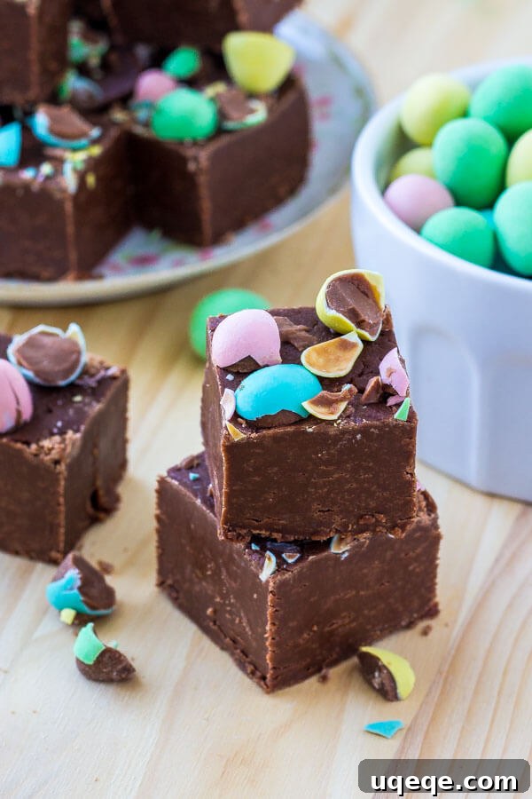 Delicious chocolate fudge, generously sprinkled with miniature candy-coated chocolate eggs, ready to be enjoyed for Easter.