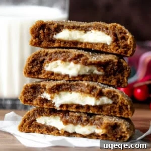Gingerbread cheesecake cookies, broken in half and stacked on top of each other
