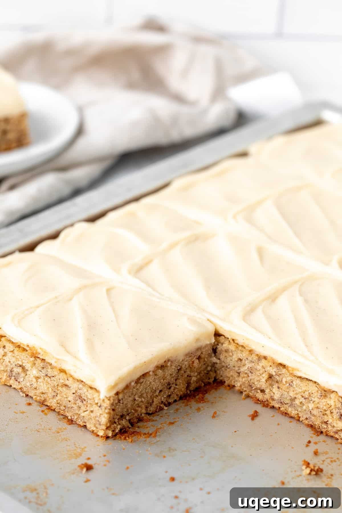 Frosted Banana Dream Bars 3 Freshly baked banana bars generously topped with smooth cream cheese frosting in a large jelly roll pan