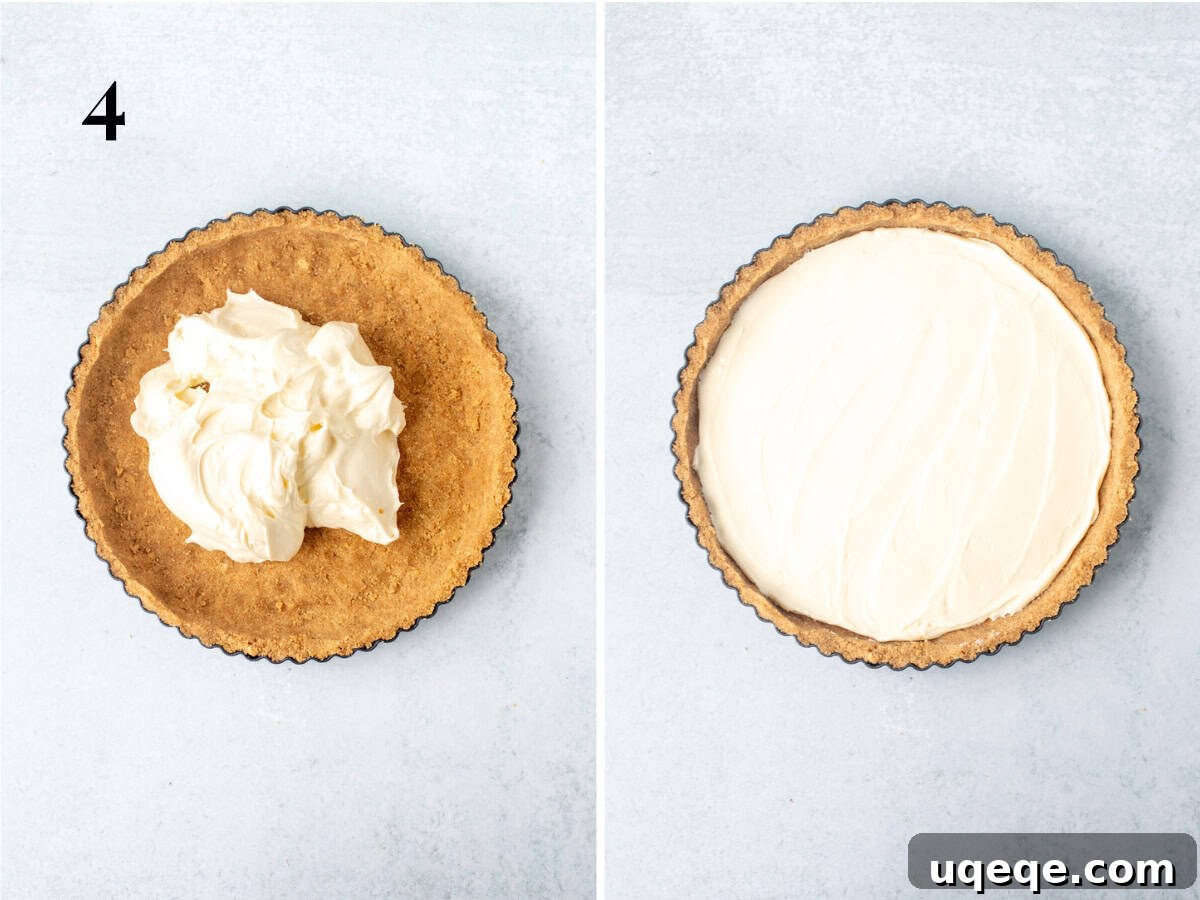 Effortless Rainbow Fruit Delight 7 An unbaked tart shell now beautifully filled with the smooth, white, creamy no-bake cream cheese mixture, patiently waiting for its final chilling before being topped with fruit.