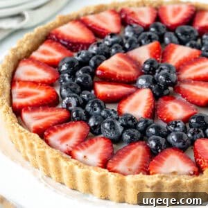 No bake fruit tart with strawberries and blueberries on top