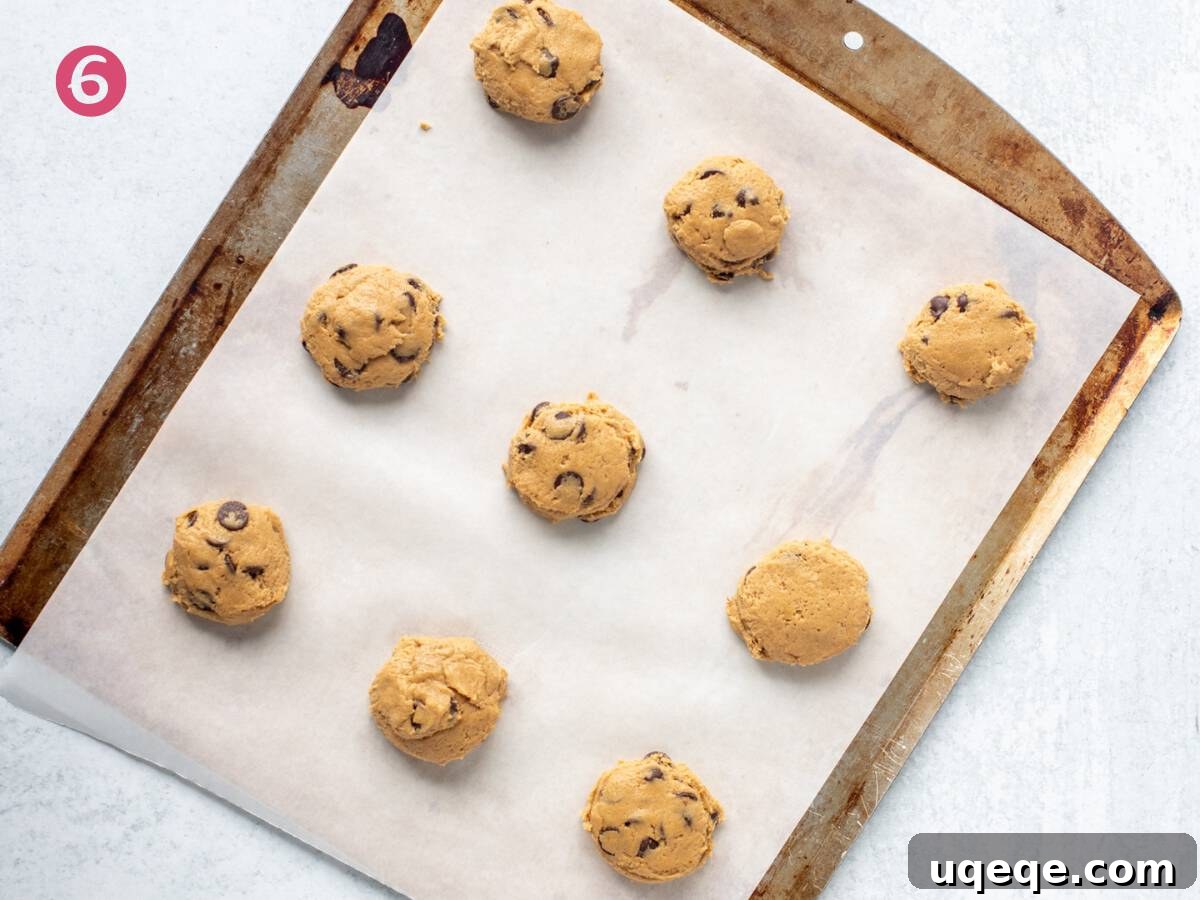 Dreamy Cream Cheese Chocolate Chip Cookies 6 Cookie sheet filled with neatly scooped cookie dough balls ready for baking.