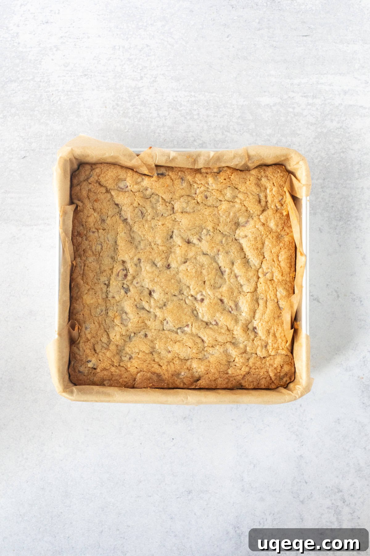 Heavenly Chocolate Chip Cheesecake Bars 11 A pan filled with freshly baked, golden-brown chocolate chip cheesecake bars