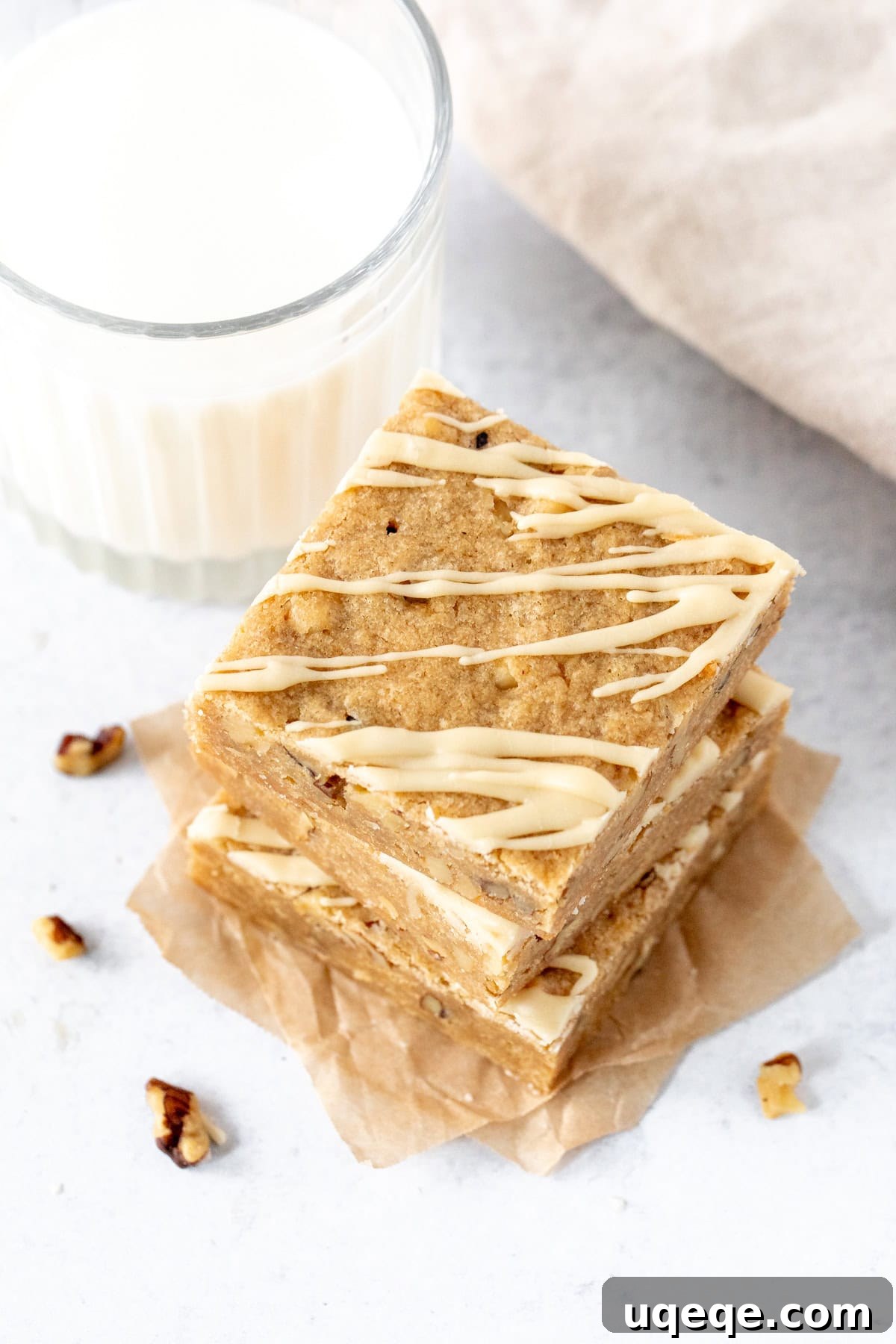 Golden Brown Butter Maple Blondies 7 Close-up of a single brown butter maple blondie, showing its chewy texture and golden color.