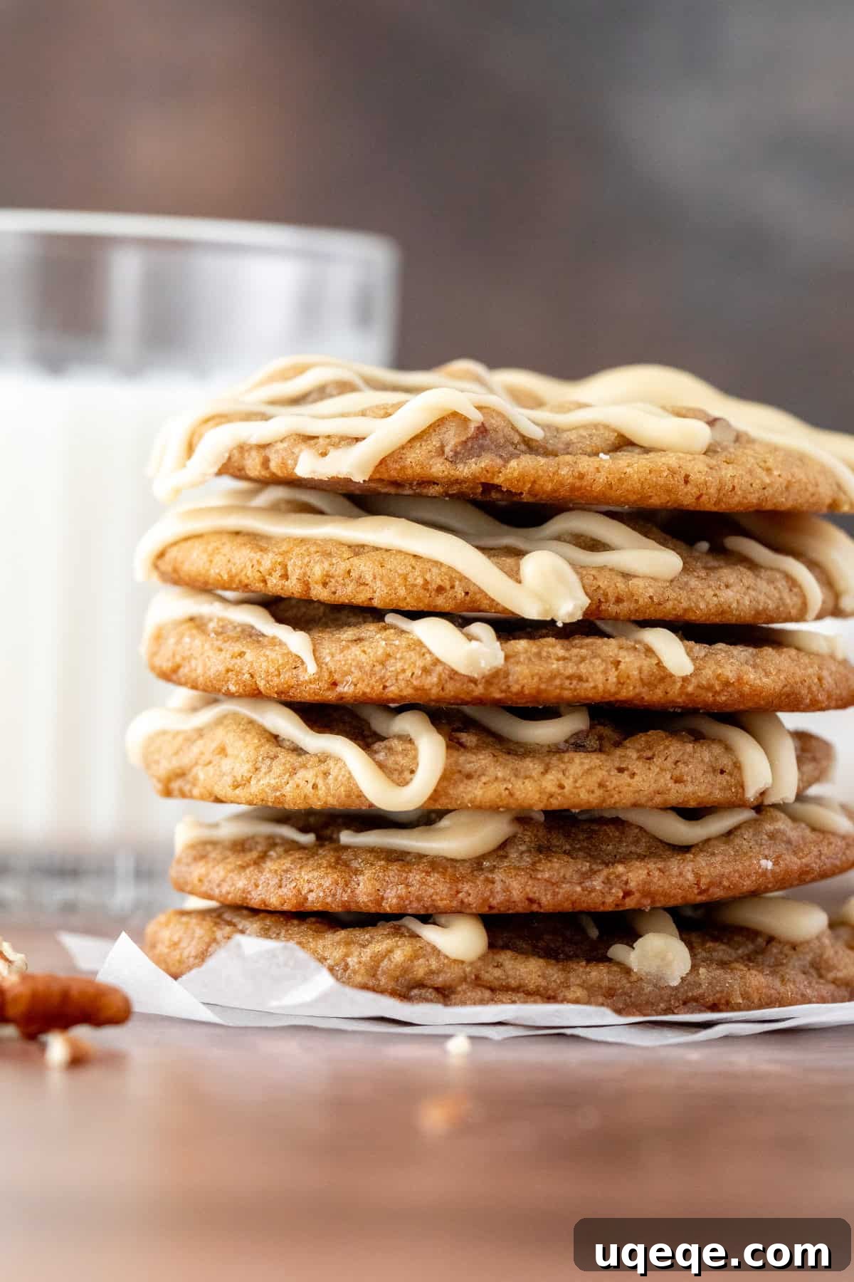 Double Maple Delight Cookies 2 Stack of golden-brown maple cookies with a delicate maple glaze, beside a glass of cold milk