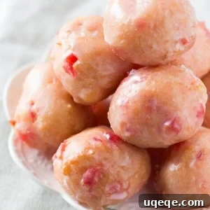 Finished Cherry Doughnut Holes, beautifully glazed and arranged, showcasing their irresistible appeal.