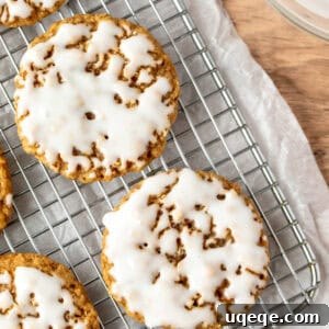 Iced oatmeal cookies on a cooling rack, ready to be enjoyed.