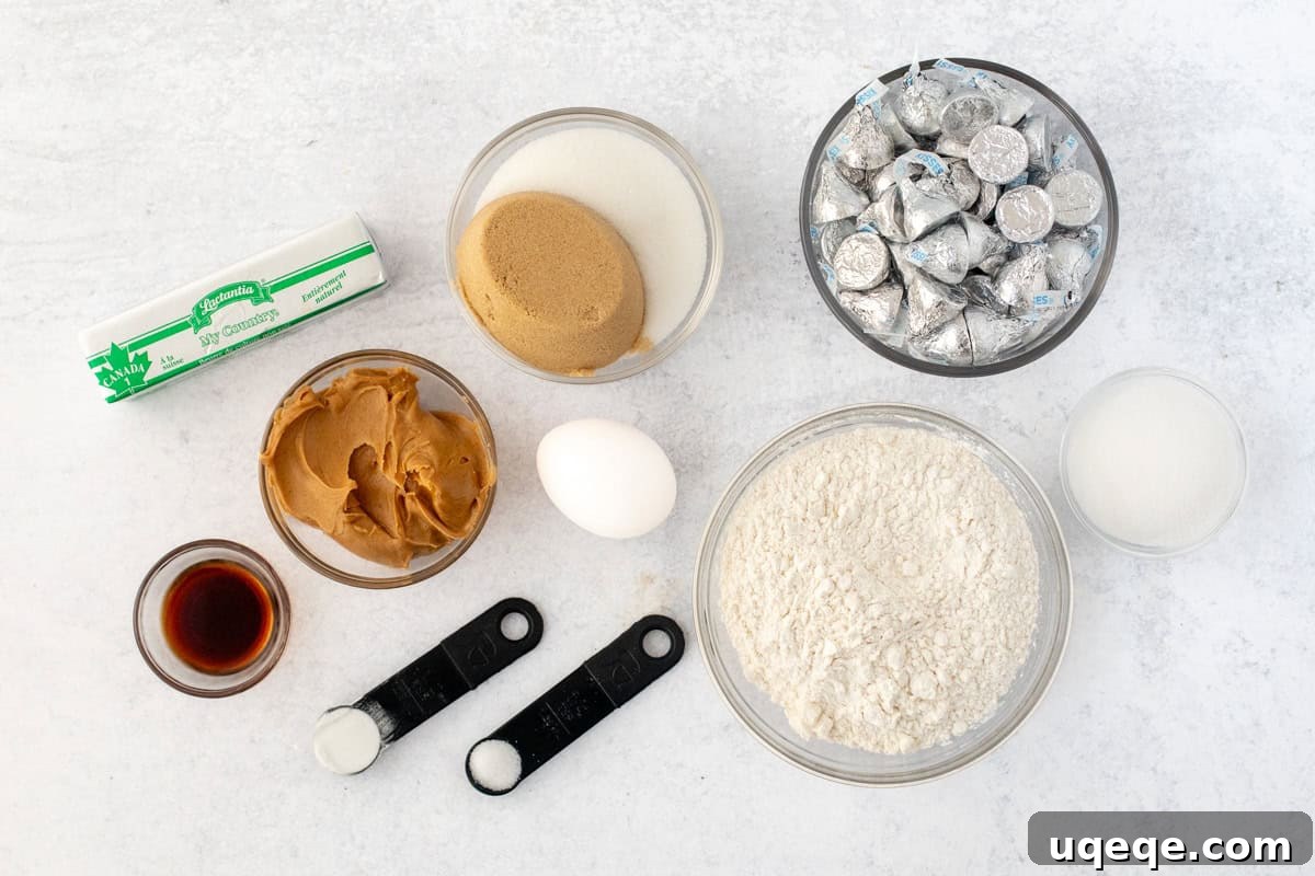 Peanut Butter Bliss Bites 5 All the pre-measured ingredients for peanut butter blossom cookies laid out on a clean surface, emphasizing preparation.