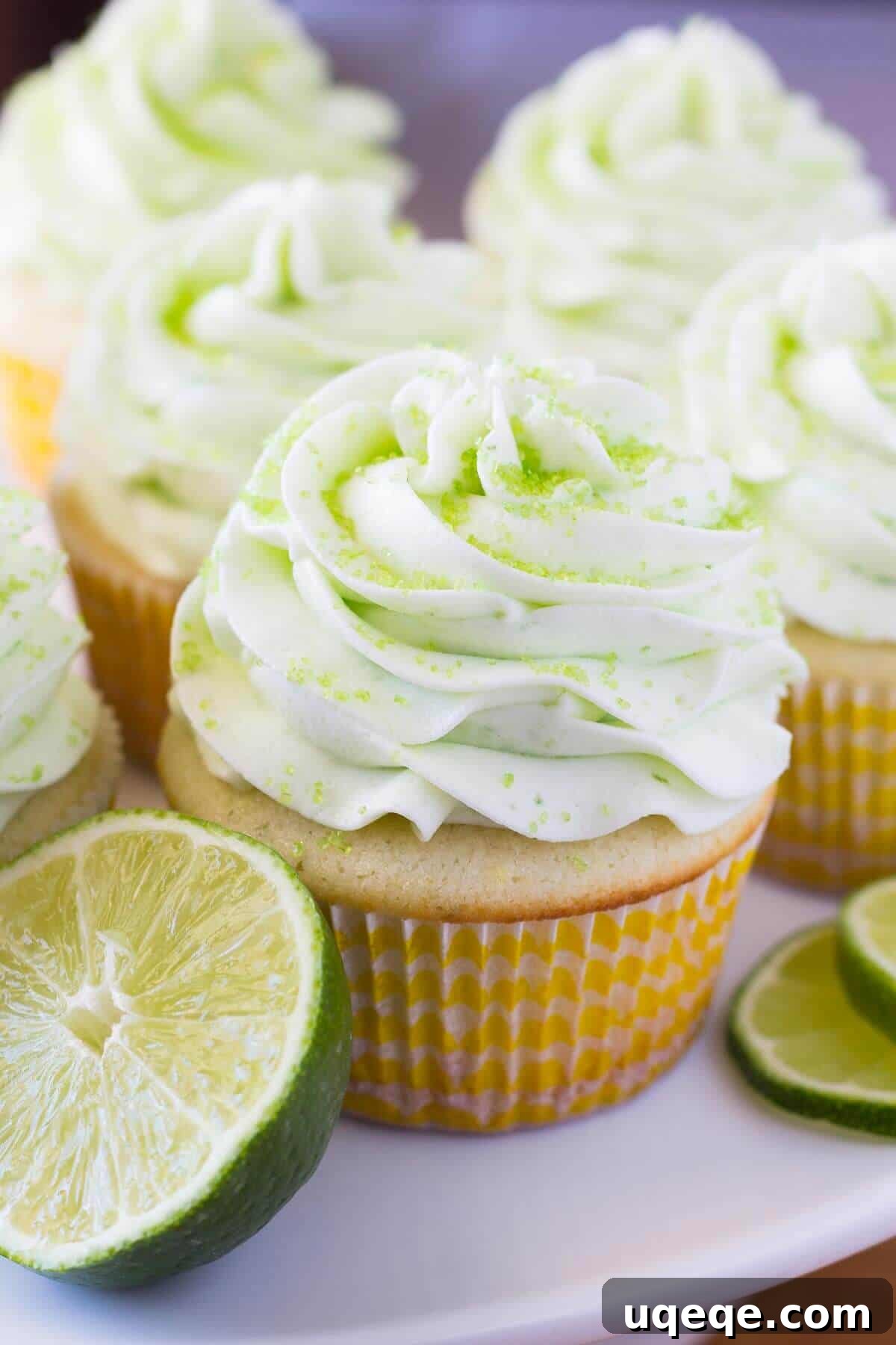 Beautifully frosted Lemon Lime Cupcakes, showcasing a light green lime buttercream and a hint of fresh citrus