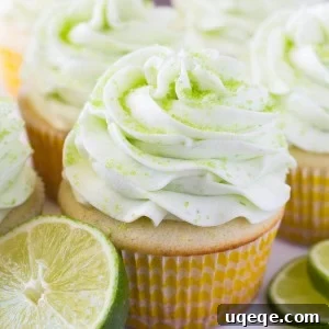 Finished Lemon Lime Cupcakes with smooth green frosting and decorative sprinkles