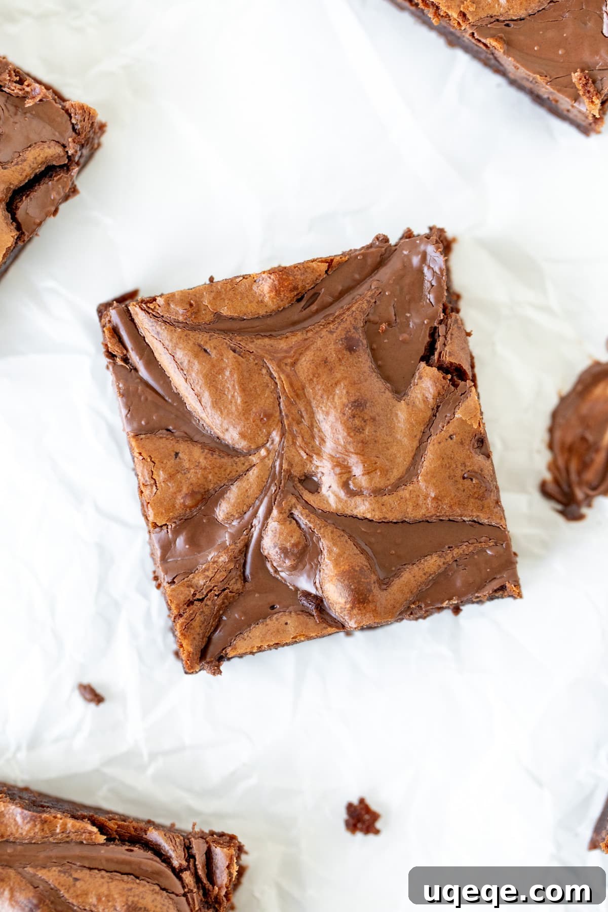 Decadent Nutella Fudge Brownies 3 Close-up view of a perfectly swirled Nutella brownie, highlighting its rich texture from above