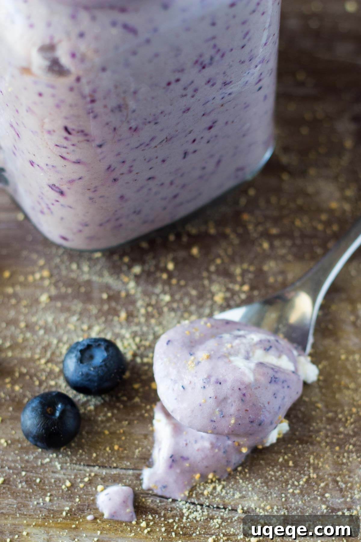 Velvet Blueberry Cheesecake Dream 3 A close-up shot of a creamy Blueberry Cheesecake Milkshake, showcasing its thick, velvety texture and vibrant blueberry swirl, making it an ideal refreshing treat.
