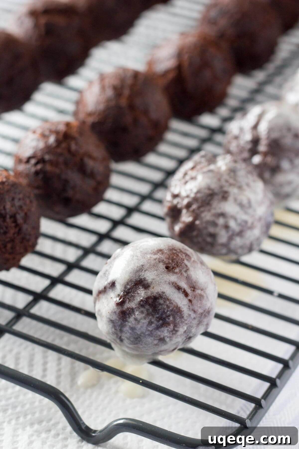 Decadent Chocolate Donut Poppers 4 Perfectly fudgy Chocolate Doughnut Holes dipped in sweet vanilla glaze! Fluffy, oh so moist & so much better than the doughnut shop!