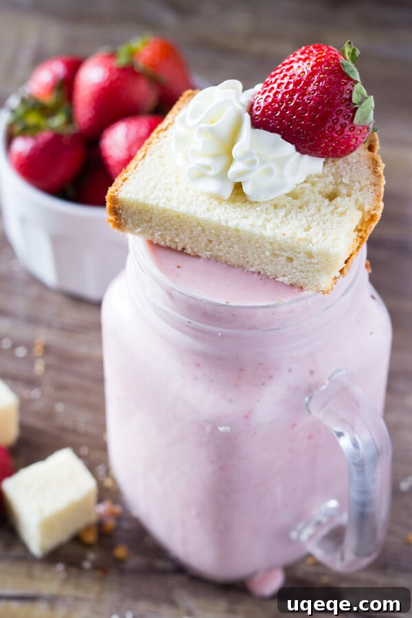 Thick and creamy Strawberry Shortcake Milkshake, a perfect summer treat with fresh strawberries and vanilla cake.