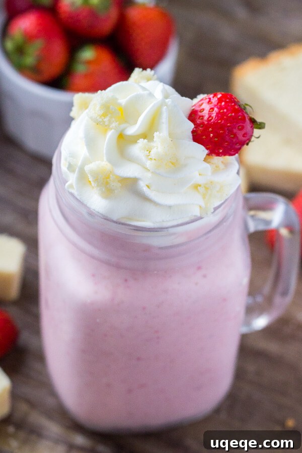 Creamy Strawberry Shortcake Milkshake in a glass, ready to be enjoyed.