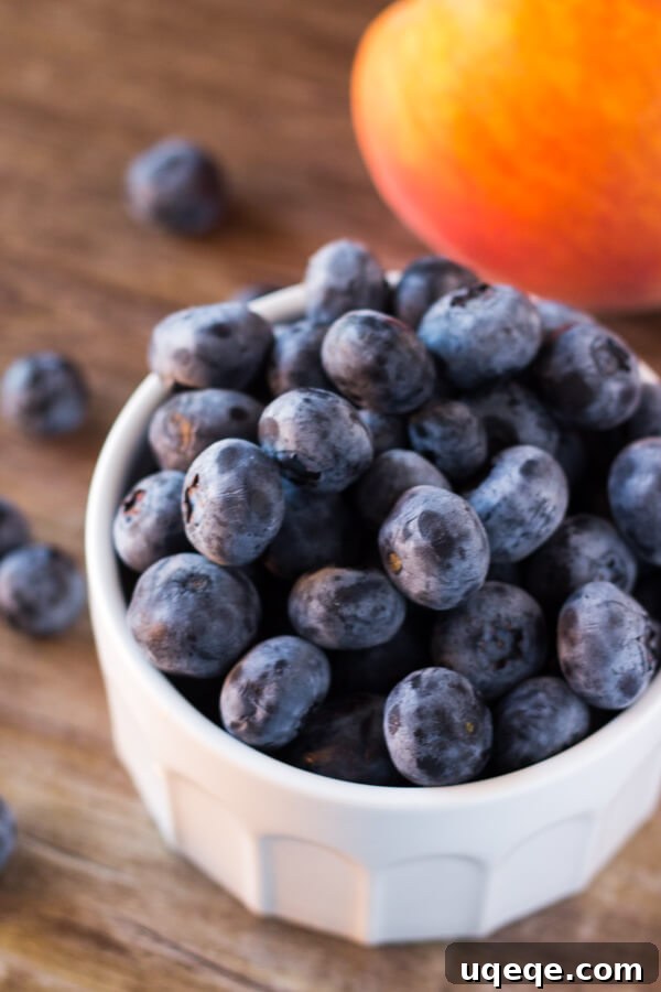 Blueberry Peach Bliss 3 A close-up of the creamy blueberry peach smoothie, highlighting its smooth texture and vibrant colors. Made with almond milk, it's a naturally sweetened, dairy-free, and refreshing vegan option.