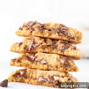 Stack of peanut butter chocolate chip cookies, broken in half