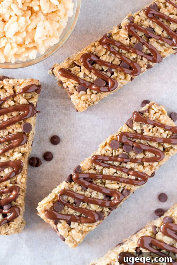 Kitchen-Crafted Granola Treats 3 Soft & chewy, no-bake Homemade Granola Bars with chocolate chips and chocolate drizzle. This peanut free granola bar recipe is so easy and so perfect for back to school!