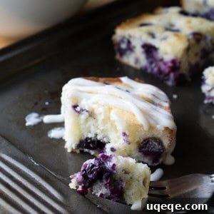 Blueberry Buttermilk Cake with Cream Cheese Glaze. Super moist & bursting with blueberries - this simple cake is perfect for summer!
