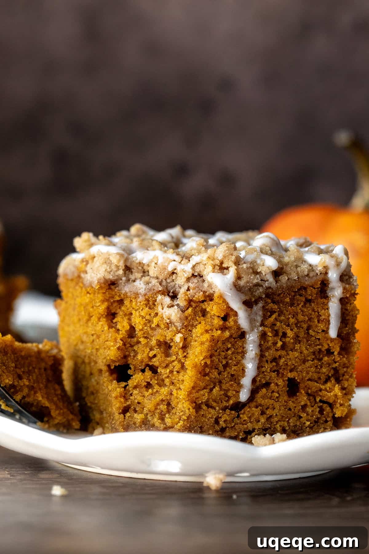 Spiced Pumpkin Crumble Coffee Cake 8 Slice of pumpkin coffee cake with bite taken out
